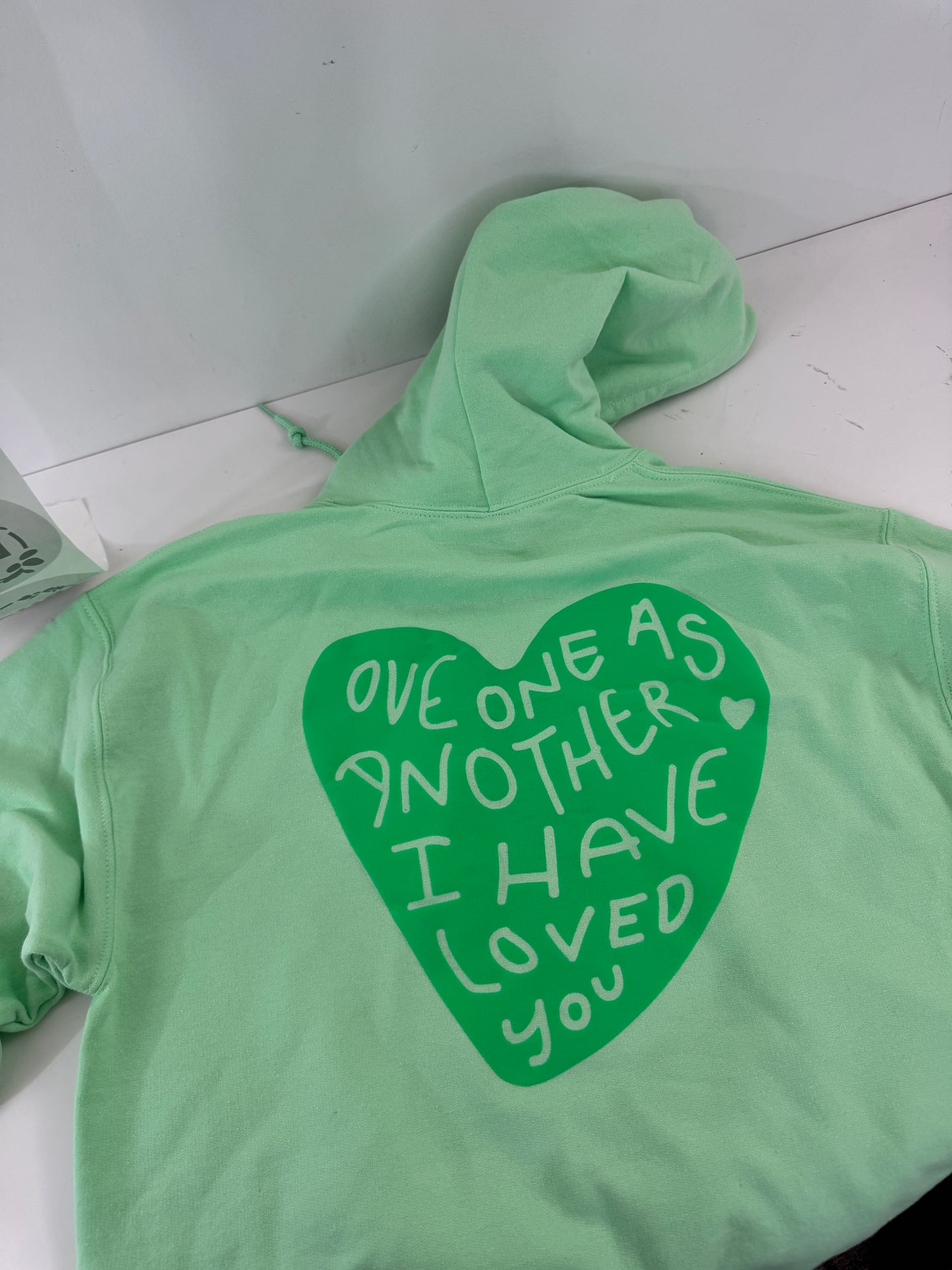OOPS! Love One Another Hoodies