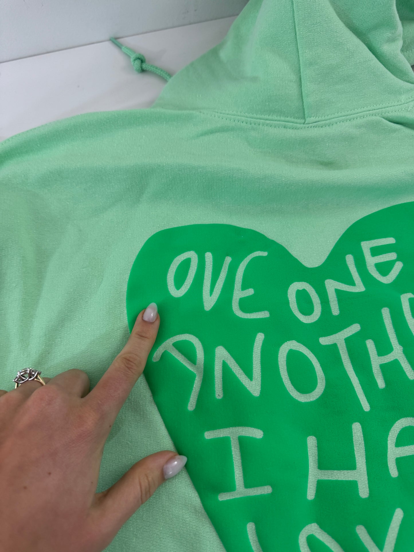OOPS! Love One Another Hoodies