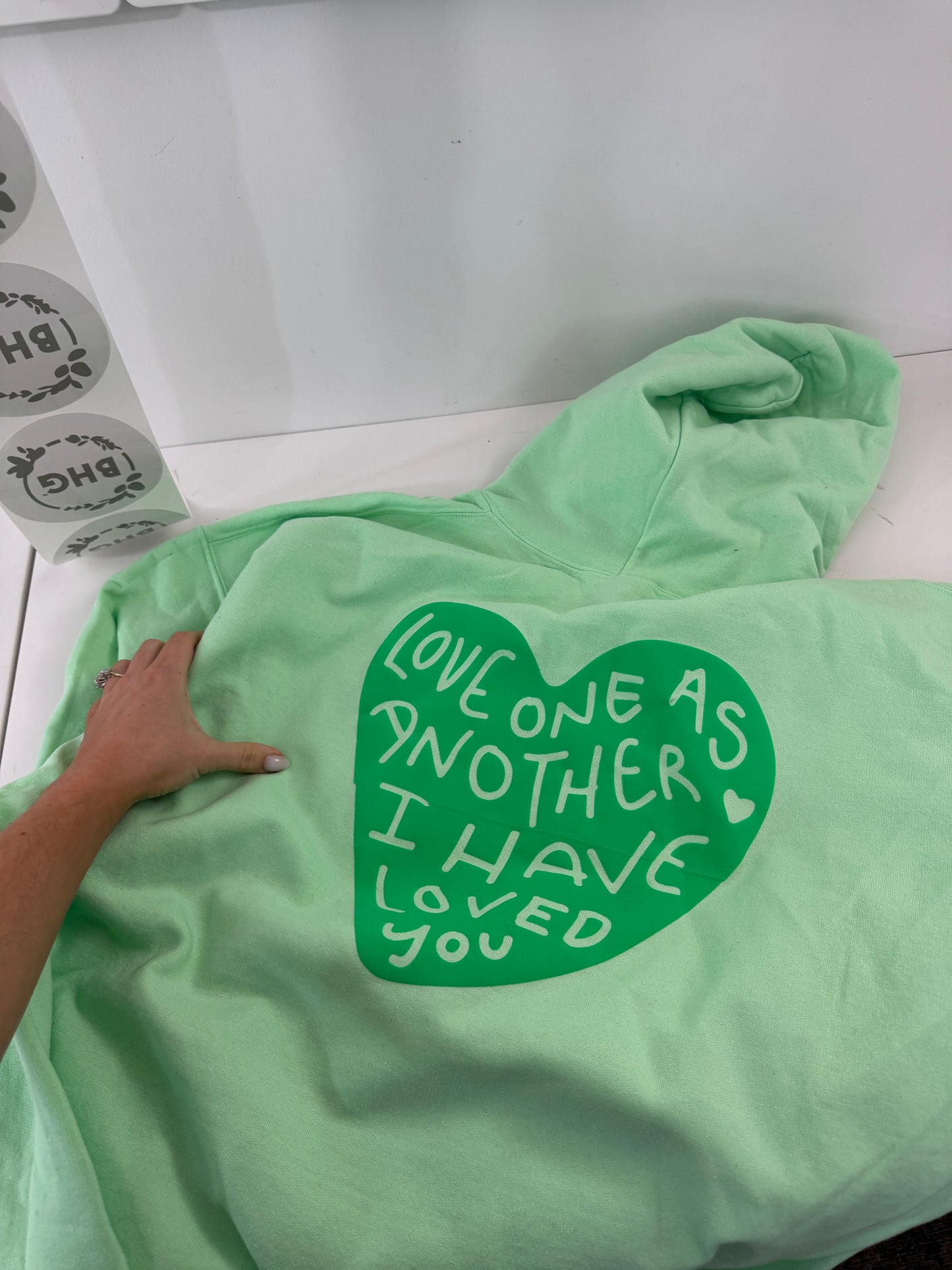 OOPS! Love One Another Hoodies